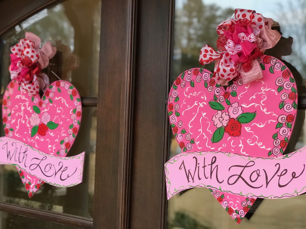 Festive pink Valentine's Day door hangers