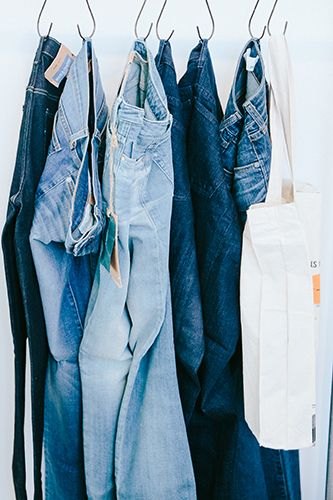 decluttter with hooks - shower curtain hooks - declutter tips - jeans - denim - refinery29 - organization - Mohawk Home